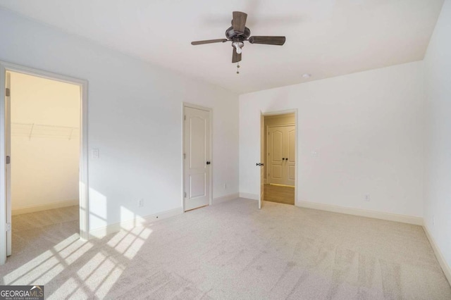 bathroom with vanity, ornamental molding, and a shower with door