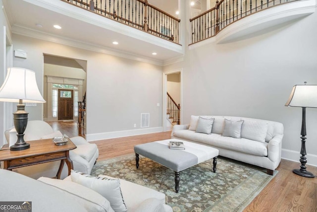 living room featuring a wealth of natural light and a high ceiling