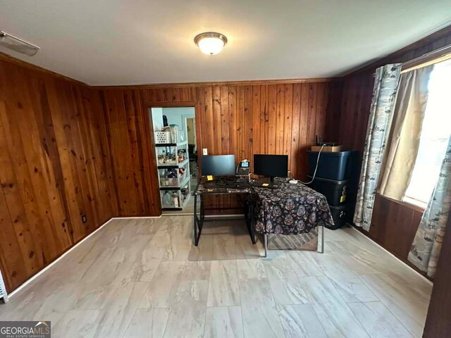 office space with a wealth of natural light and wood walls