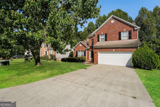 view of front property with a garage and a front yard