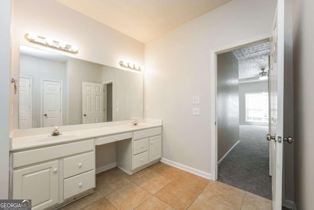 bathroom with tile patterned floors, ceiling fan, and vanity