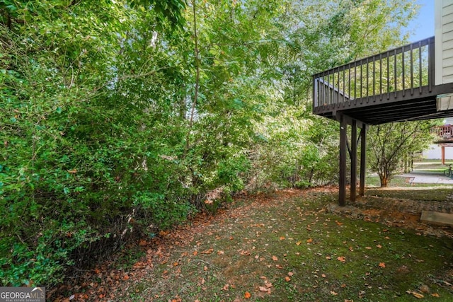 view of yard with a deck