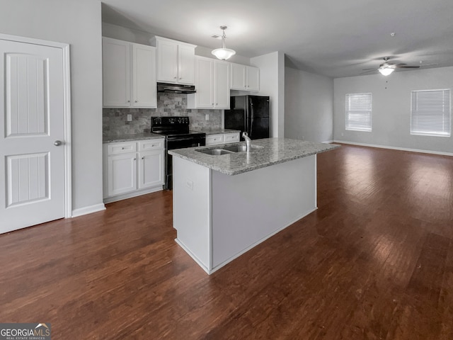 kitchen featuring an island with sink, white cabinets, black appliances, and ceiling fan