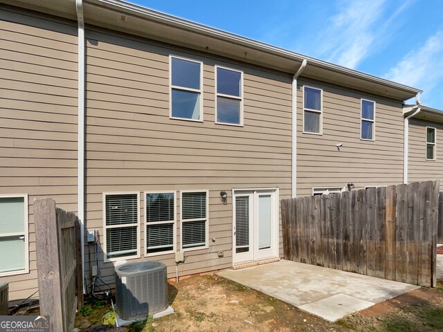 back of house featuring central AC unit and a patio