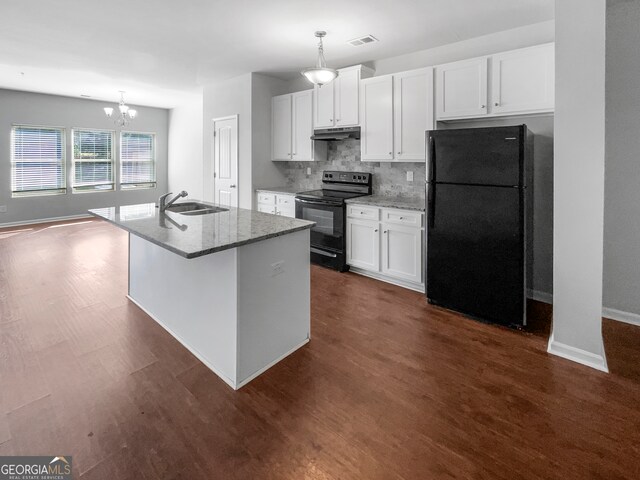 kitchen with pendant lighting, a kitchen island with sink, white cabinetry, and black appliances