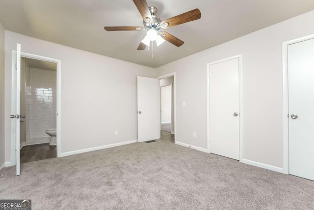 unfurnished bedroom featuring connected bathroom, ceiling fan, and light colored carpet