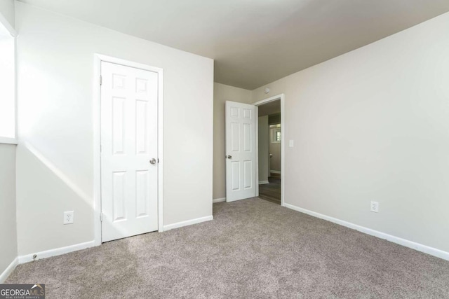 unfurnished bedroom featuring carpet