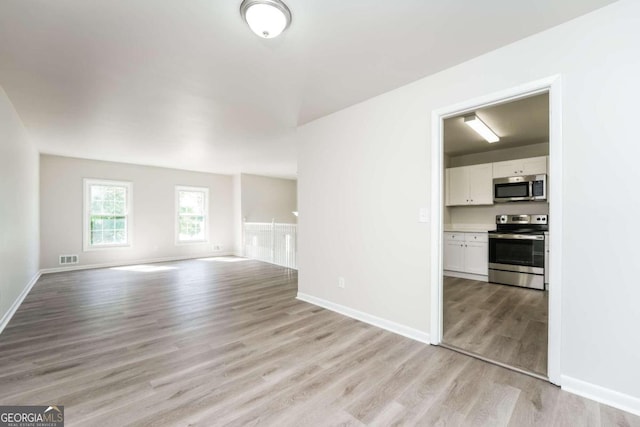 empty room with light wood-type flooring