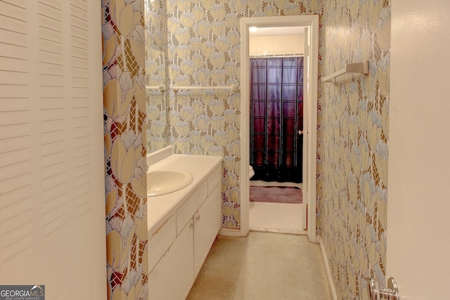 bathroom with vanity and curtained shower