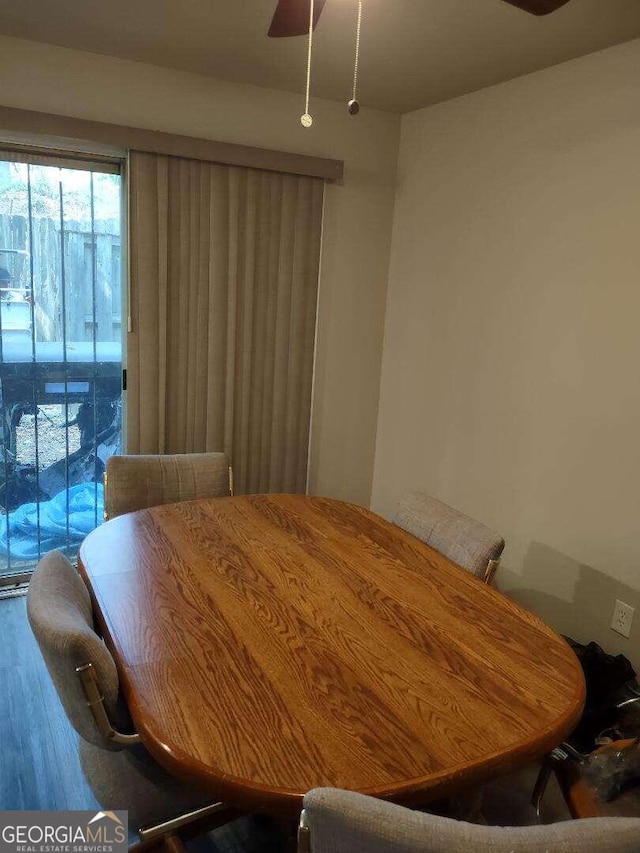 dining room featuring ceiling fan and hardwood / wood-style floors