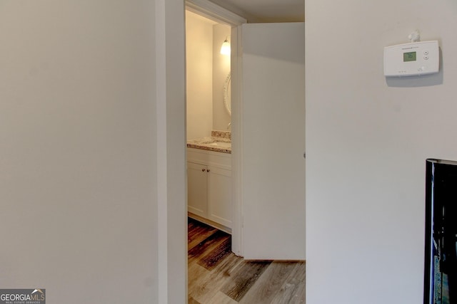 corridor featuring light hardwood / wood-style floors