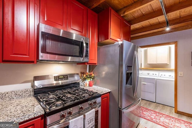 kitchen with light wood-style flooring, separate washer and dryer, wood ceiling, appliances with stainless steel finishes, and beam ceiling