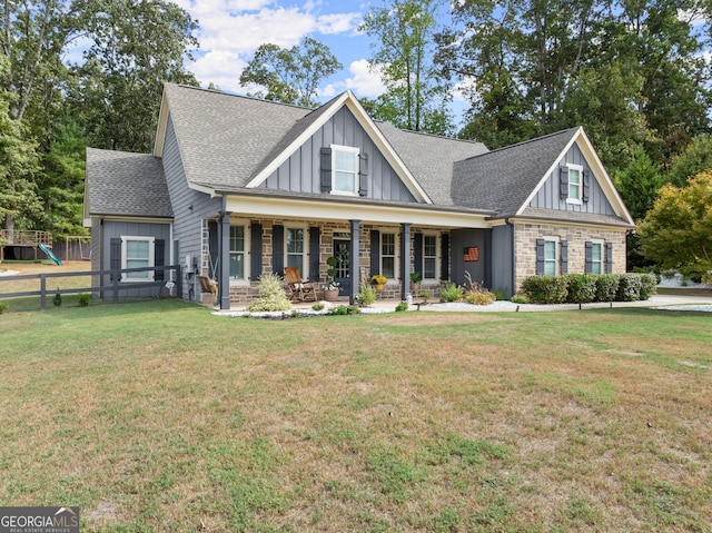 craftsman-style home with a front yard and a porch