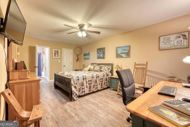 bedroom with ceiling fan, ensuite bathroom, and light hardwood / wood-style floors