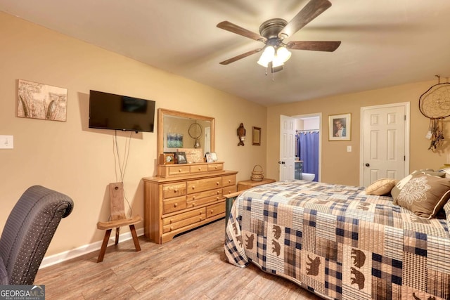 bedroom featuring hardwood / wood-style floors, ceiling fan, and a closet