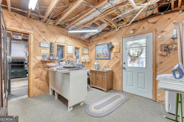 interior space with wood walls and light carpet