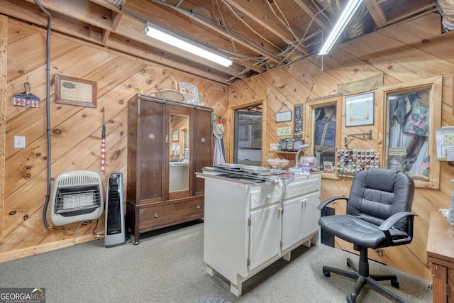 carpeted office featuring wooden walls and heating unit