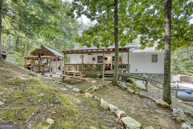 back of property featuring a wooden deck