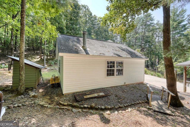 view of home's exterior featuring a shed