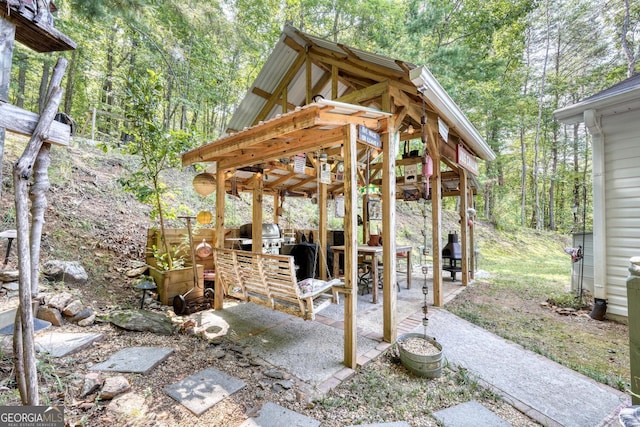 view of patio featuring a grill