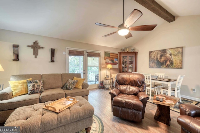 living room with ceiling fan, hardwood / wood-style flooring, and lofted ceiling with beams