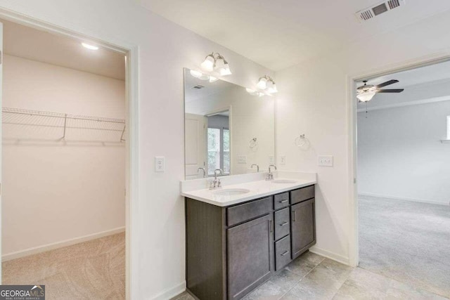 bathroom featuring vanity and ceiling fan