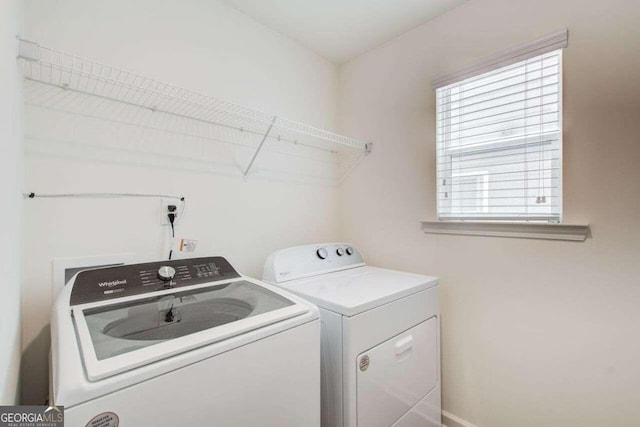 laundry area featuring washing machine and clothes dryer