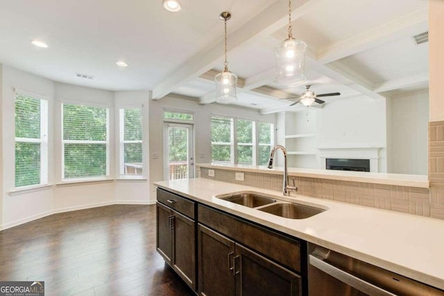 kitchen with ceiling fan, beam ceiling, sink, decorative light fixtures, and dark hardwood / wood-style floors