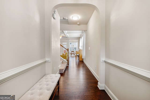 hall featuring beam ceiling, dark hardwood / wood-style floors, and coffered ceiling