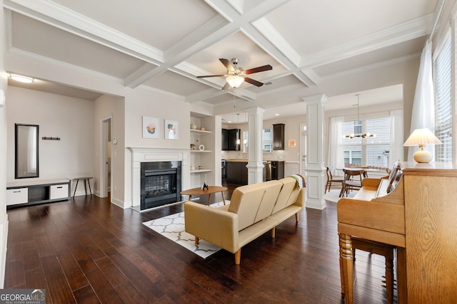 living room with built in shelves, beamed ceiling, and coffered ceiling