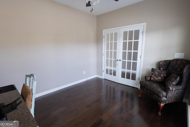 living area featuring french doors, ceiling fan, and dark hardwood / wood-style floors