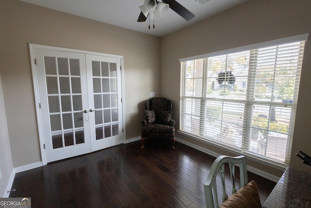 unfurnished room with a healthy amount of sunlight, ceiling fan, french doors, and dark wood-type flooring