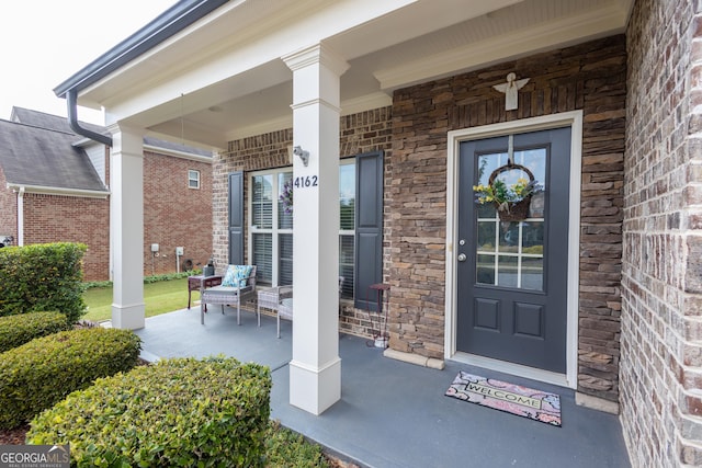 entrance to property with a porch