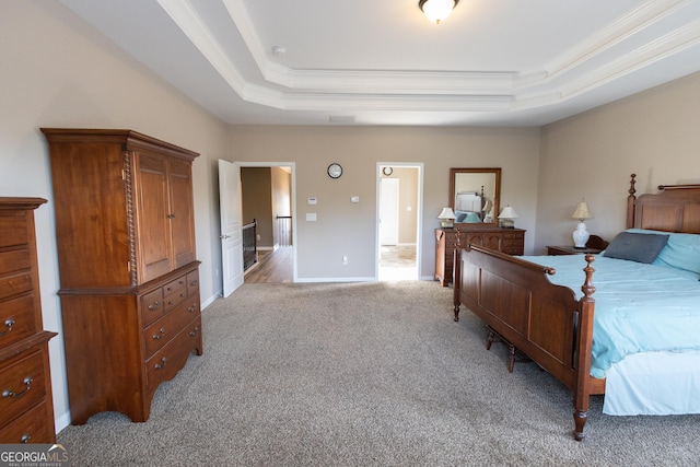 bedroom featuring a raised ceiling, light carpet, and crown molding