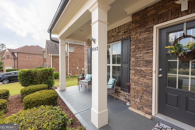 view of exterior entry with a porch