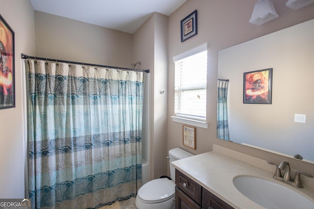 full bathroom featuring toilet, shower / bathtub combination with curtain, and vanity