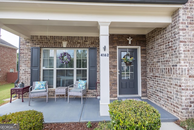 property entrance with covered porch