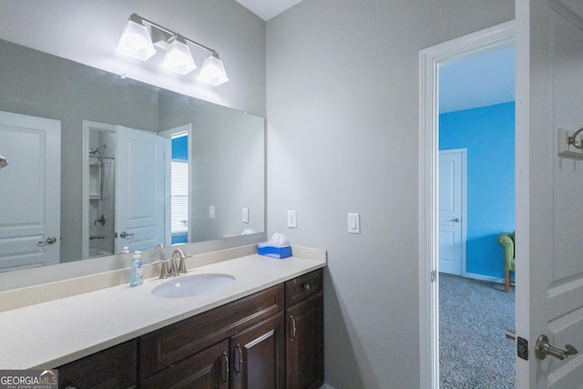 bathroom featuring bathing tub / shower combination and vanity