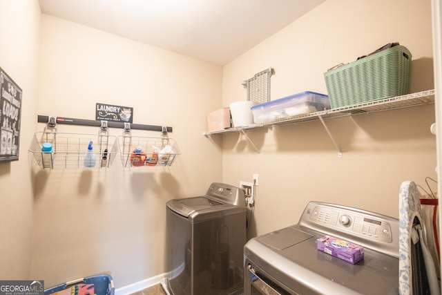 washroom with washing machine and dryer