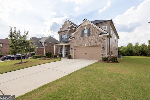 craftsman house featuring cooling unit, a front yard, and a garage