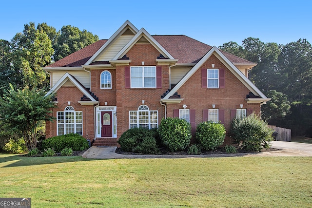 view of front of property with a front lawn