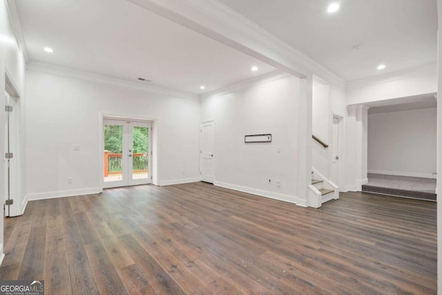 spare room with dark hardwood / wood-style floors and crown molding