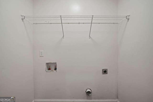 clothes washing area with washer hookup and electric dryer hookup