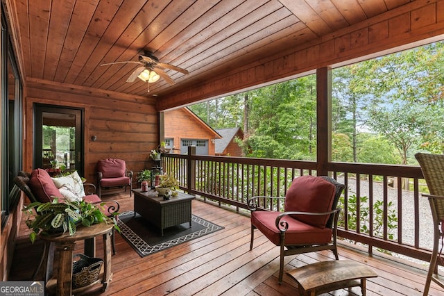 wooden deck featuring ceiling fan and an outdoor hangout area