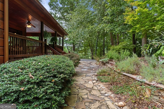 view of yard featuring ceiling fan