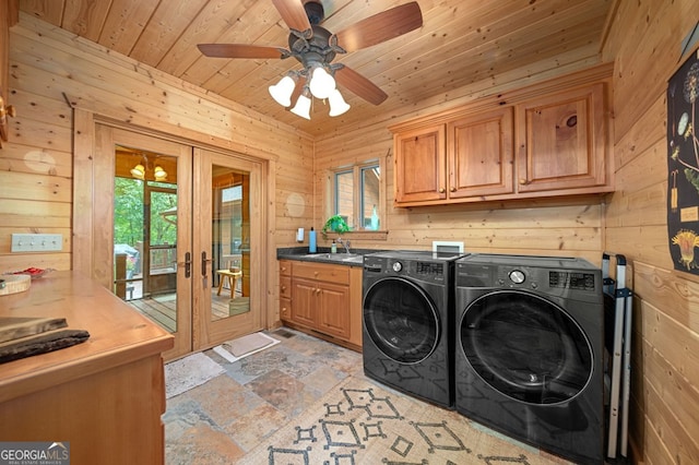 laundry room with wooden walls, independent washer and dryer, ceiling fan, wooden ceiling, and french doors