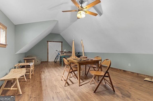 interior space with ceiling fan, light hardwood / wood-style floors, and vaulted ceiling