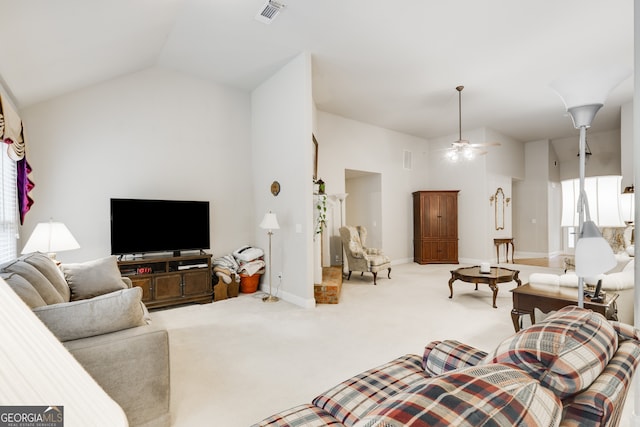 living room with light colored carpet, vaulted ceiling, and ceiling fan