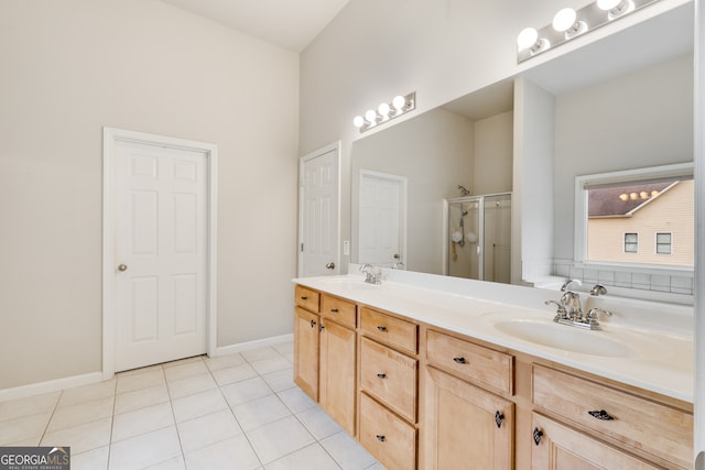 bathroom featuring vanity, a towering ceiling, tile patterned floors, and an enclosed shower