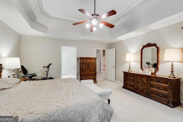 carpeted bedroom with crown molding, a raised ceiling, and ceiling fan